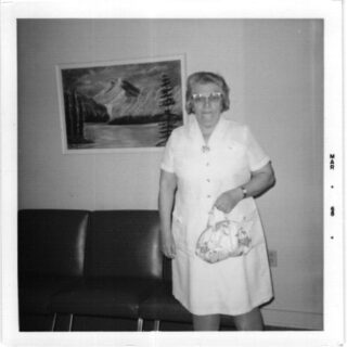 Senior woman pictured with handbag, indoors, Senior Living