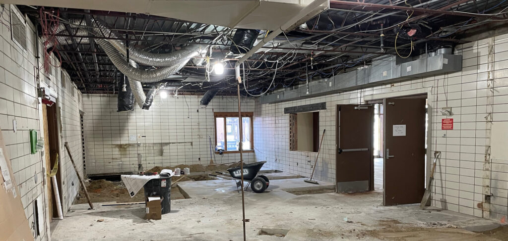Chapel renovation in progress at Valley View Village, showing exposed ceiling ducts, construction materials and unfinished walls.